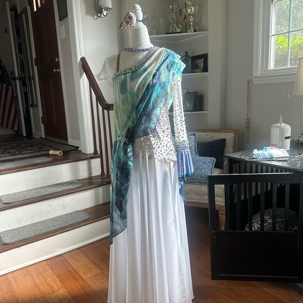 Ballroom dance gown, smooth, multi color chiffon drape over white gown.